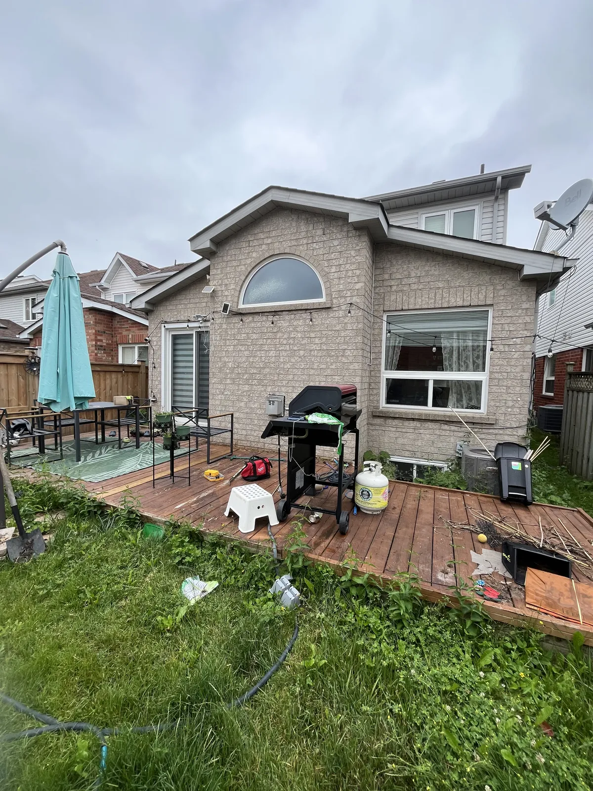 Backyard area full of old debris before cleanup