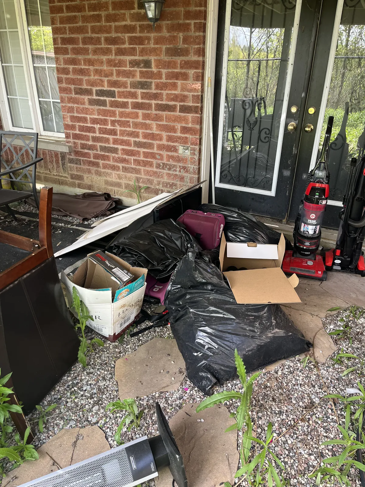Front entrance full of clutter and old items before removal