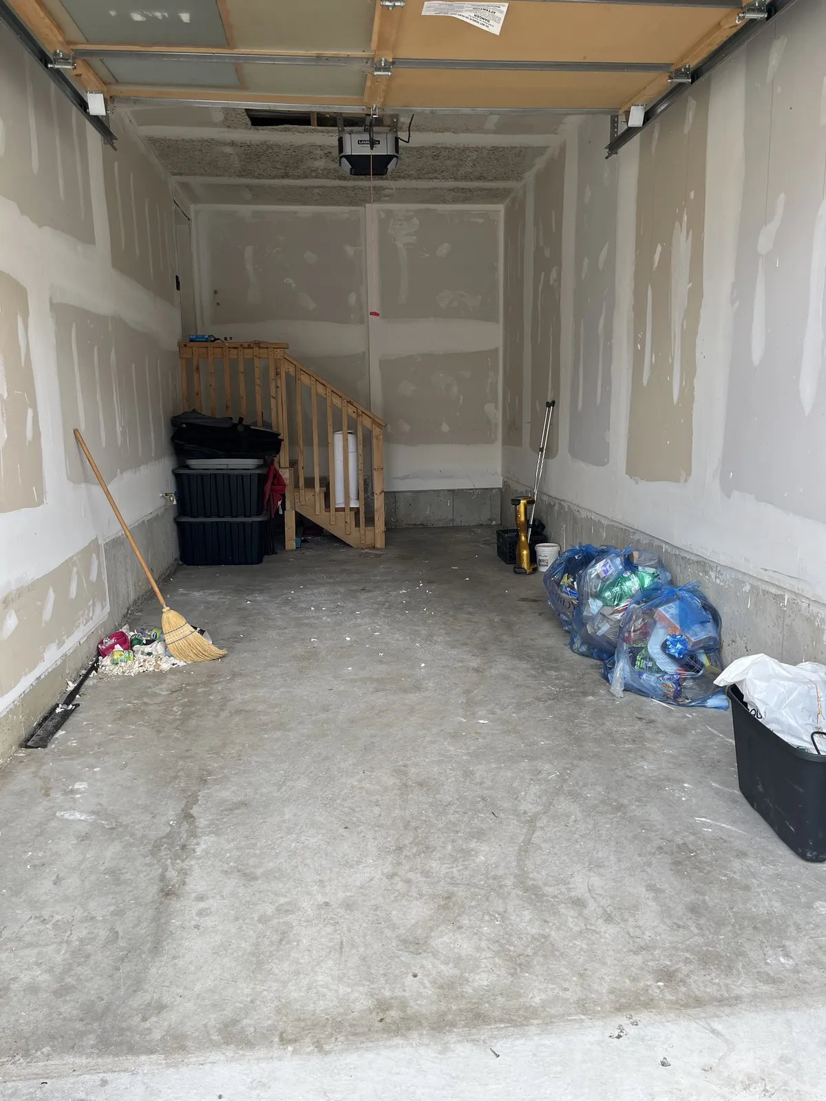 Same garage turned into an open, clear space after the haul-away