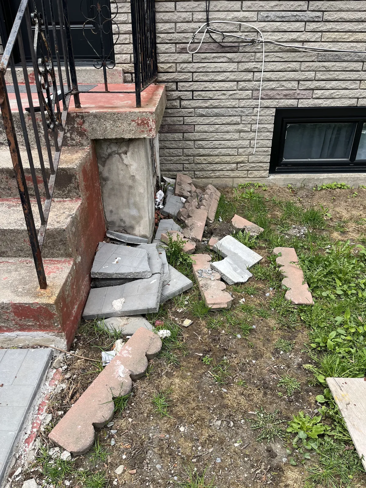 Tile debris and leftover renovation waste before cleanup